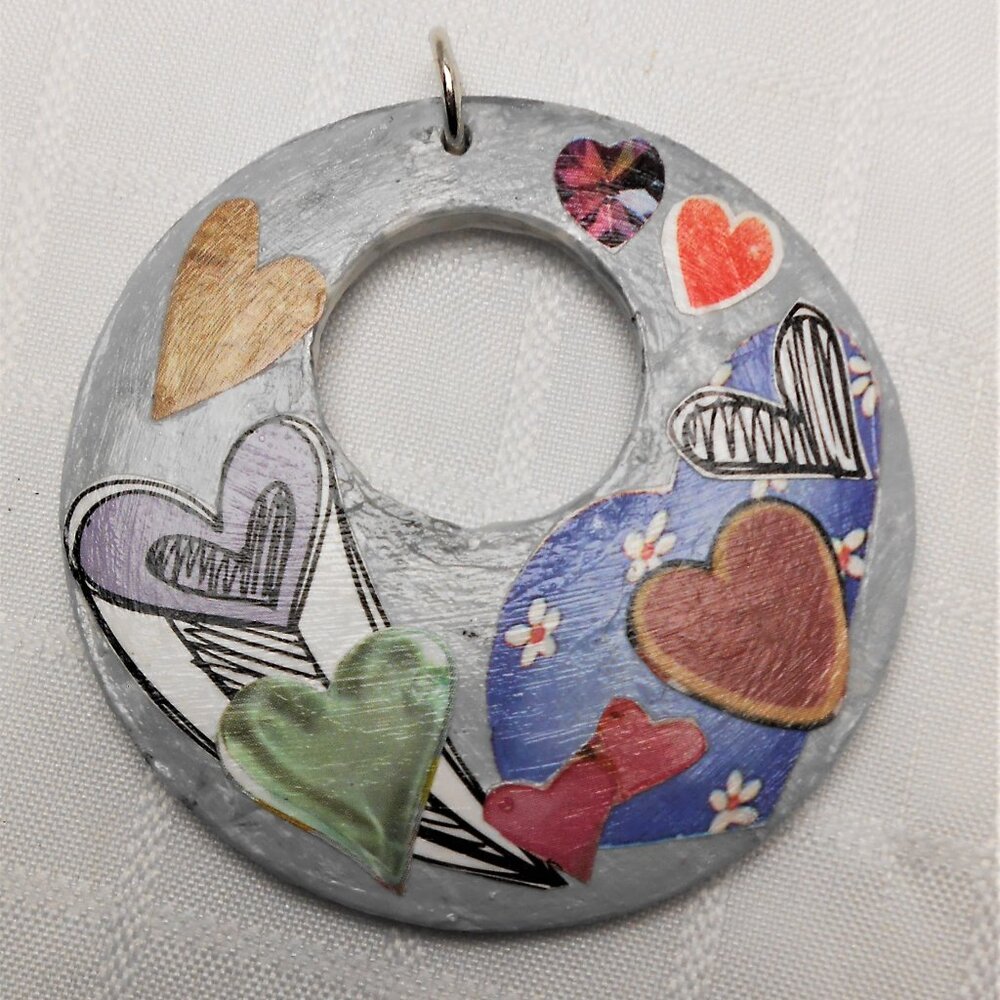 Handmade collages on a wood pendant